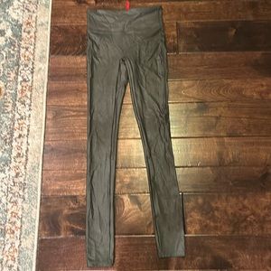 Spanx faux leather leggings in an olive green color